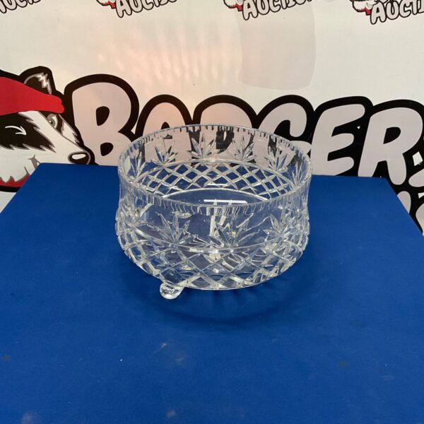 Large crystal punch bowl with intricate cut glass design.