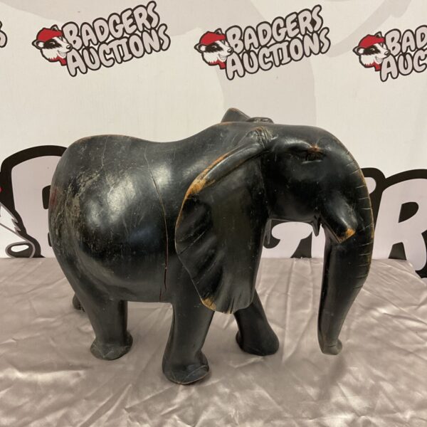 Large hand carved wooden elephant sculpture for home decor.