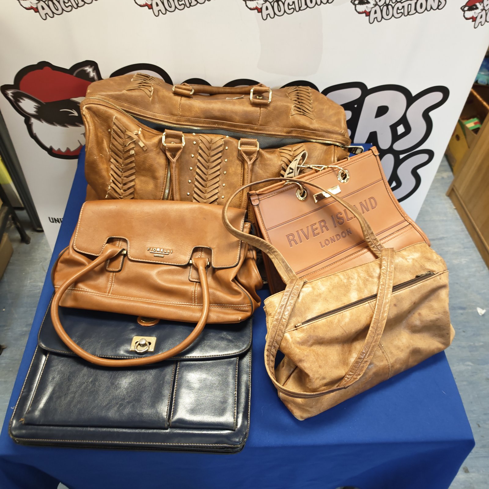 Leather handbag bundle featuring Steve Madden and River Island bags.