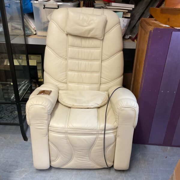 Light-coloured leather reclining massage chair for home relaxation.