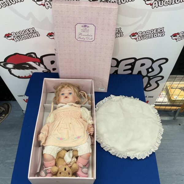 Delicate porcelain baby doll from The Leonardo Collection.