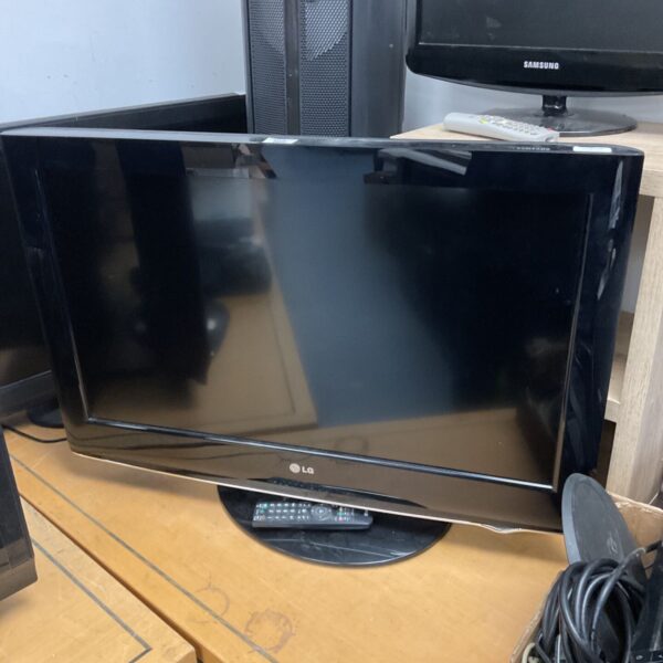 Black LG 32 inch HD television with remote control displayed.