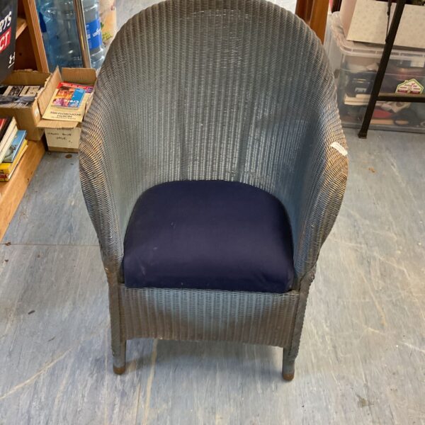 Vintage Lloyd Loom bucket chair with woven seat and back.