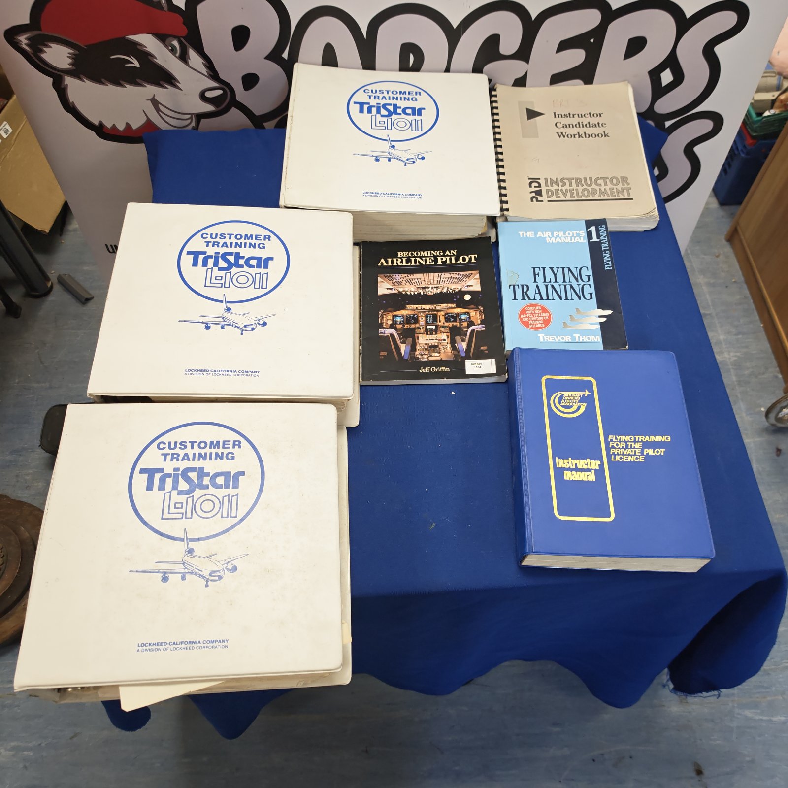 Vintage Lockheed pilot training manuals and workbooks for aviation instruction.