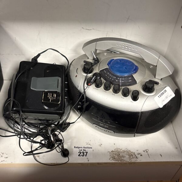 Vintage Logik cassette player with radio, showing wear and tear.