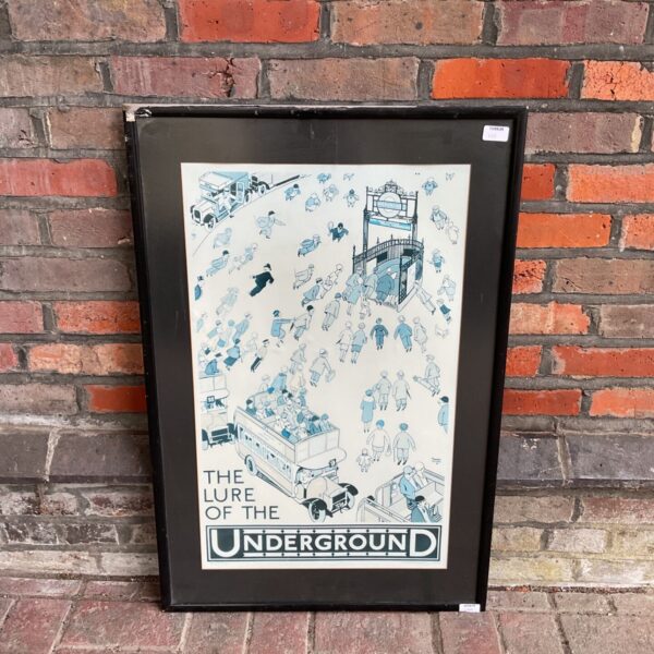 Framed London Underground poster print depicting a busy station scene.