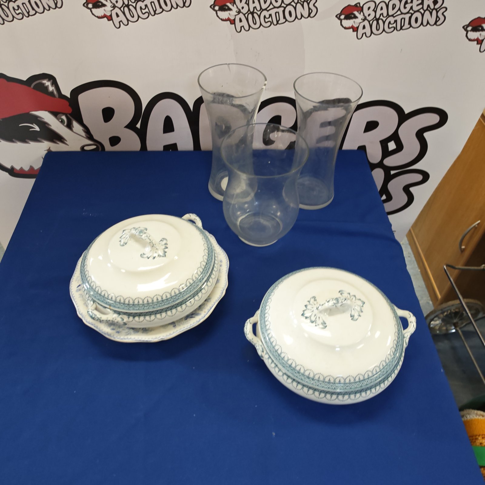 Vintage Losolware serving dishes and glass vases on display.