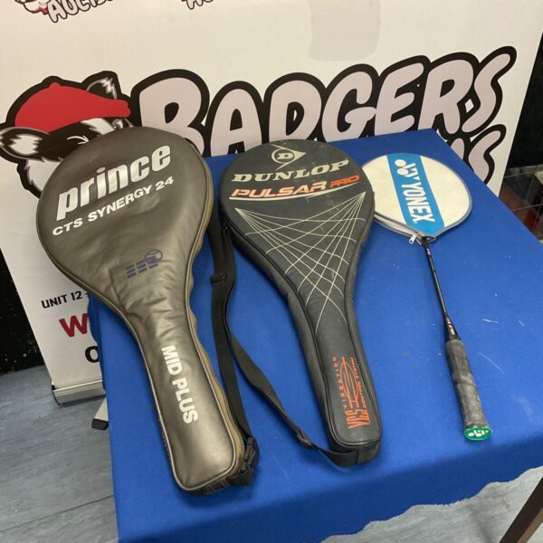 Two tennis and one badminton rackets