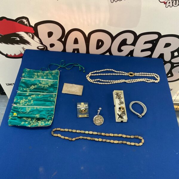 Selection of costume jewellery with silk makeup bag