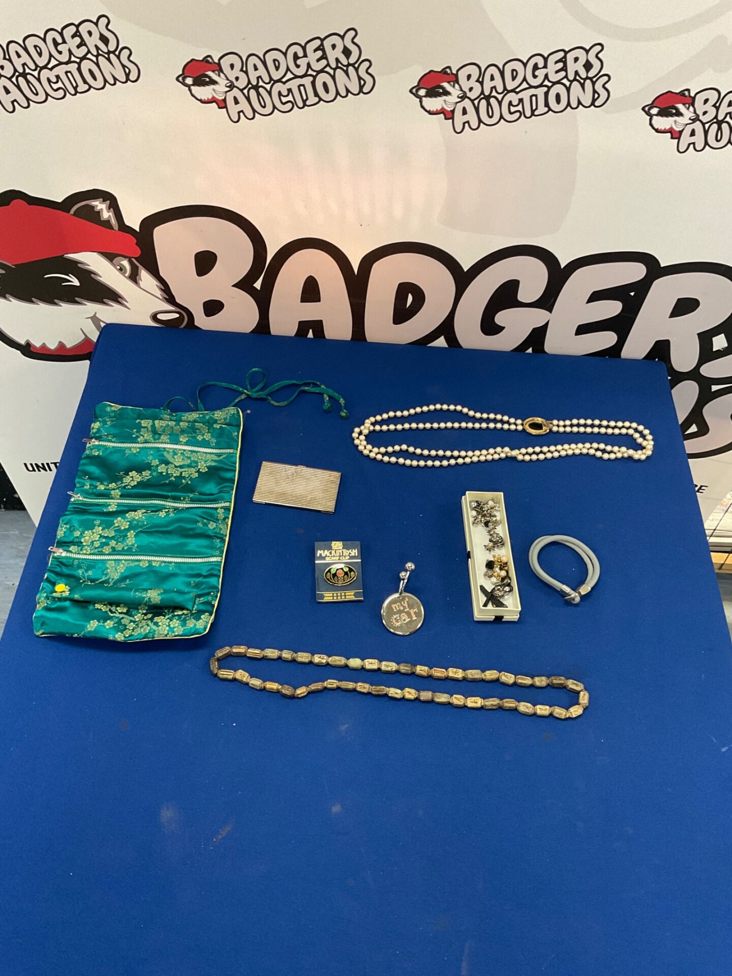 287 Selection of costume jewellery with silk makeup bag