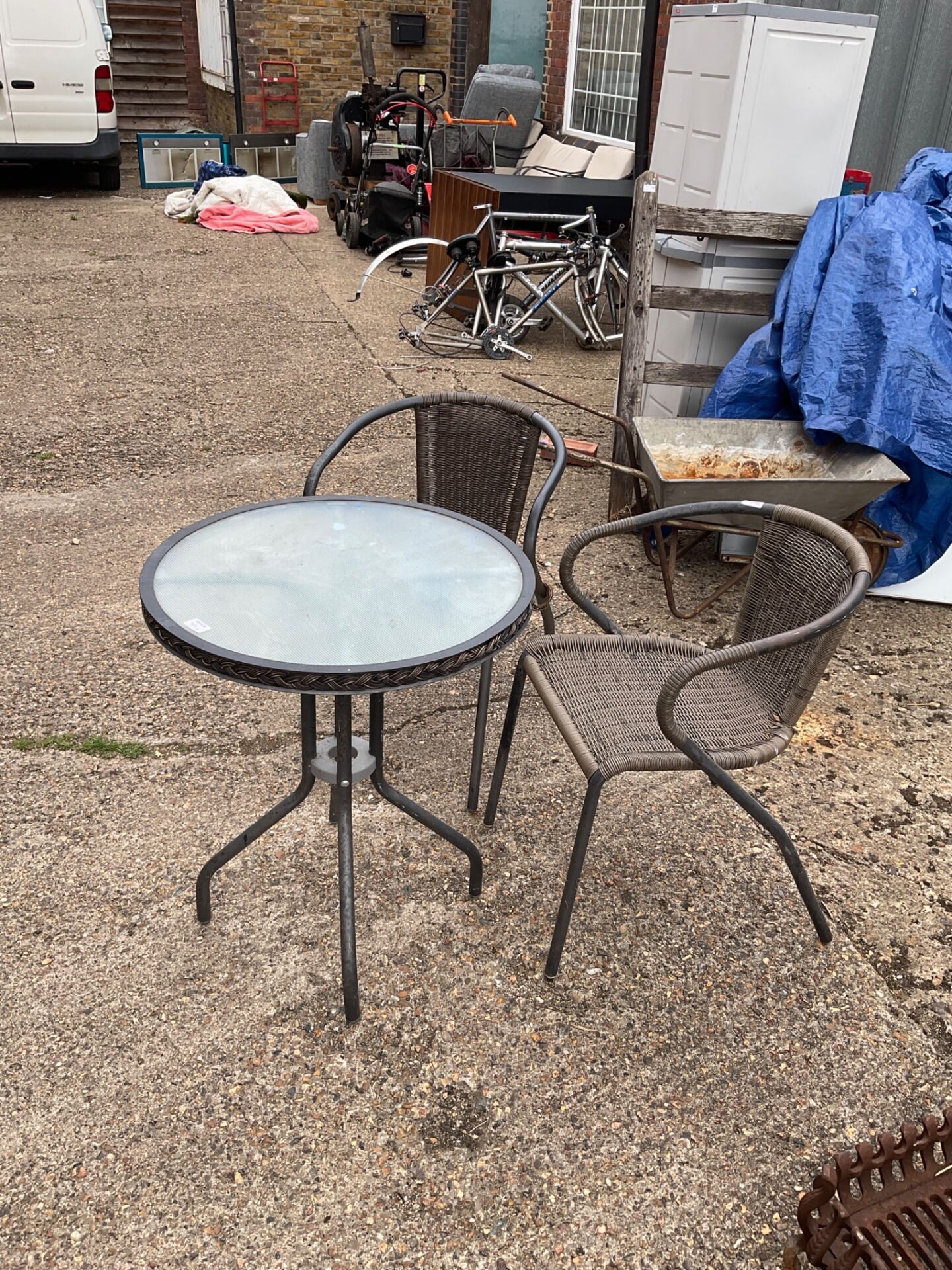 1274 Two garden chairs and glass topped table