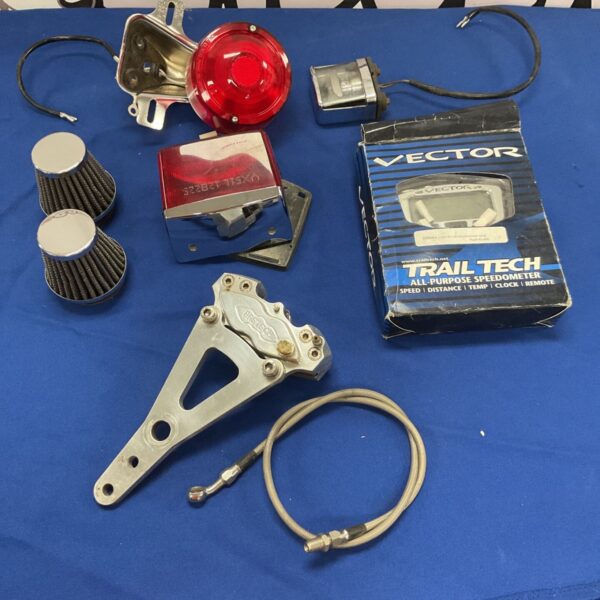 Bag of motorbike parts including lights & vector speedometer
