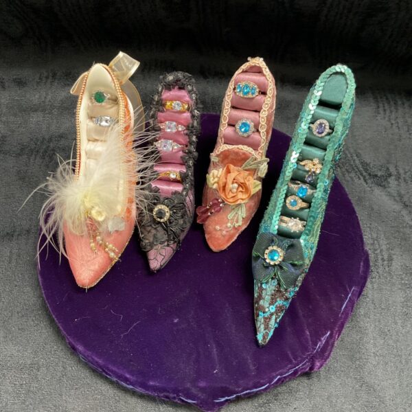 Four High heel Shoe Ring Stands With assortment of rings