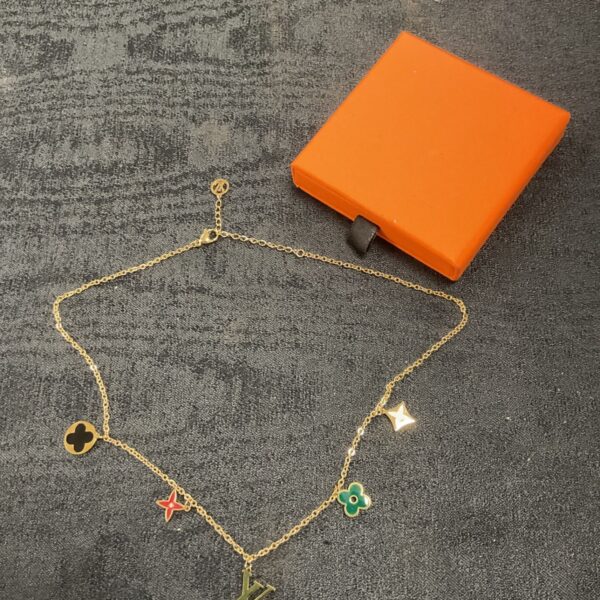 Vintage Louis Vuitton necklace with enamel flower and LV charms.