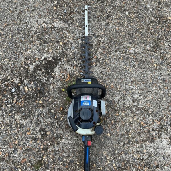Used MacAllister MHTP245-3 electric hedge trimmer for garden maintenance.