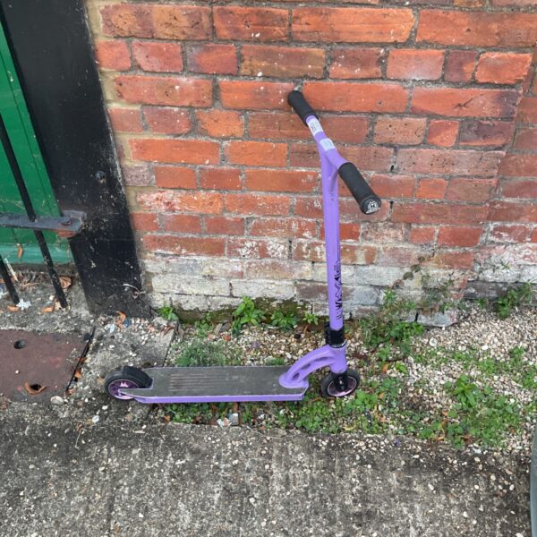 Purple Madd Gear Pro stunt scooter for freestyle riding.