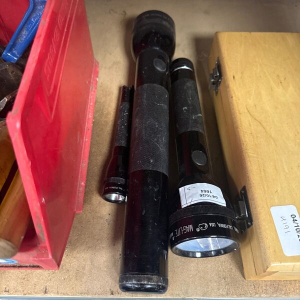 Vintage black Maglite 3D cell torch, showing signs of use.