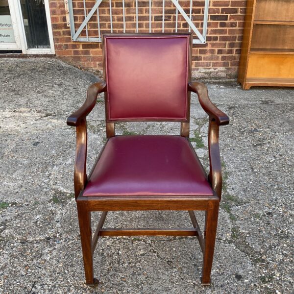 Vintage mahogany carver armchair with burgundy leather upholstery.