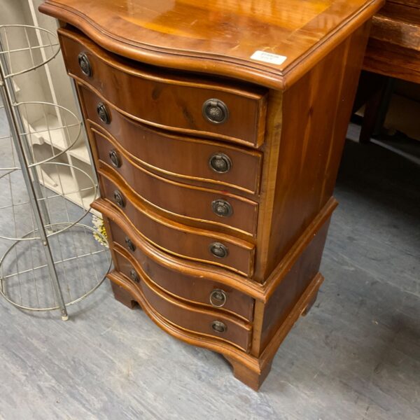 Small mahogany chest of drawers with five drawers.
