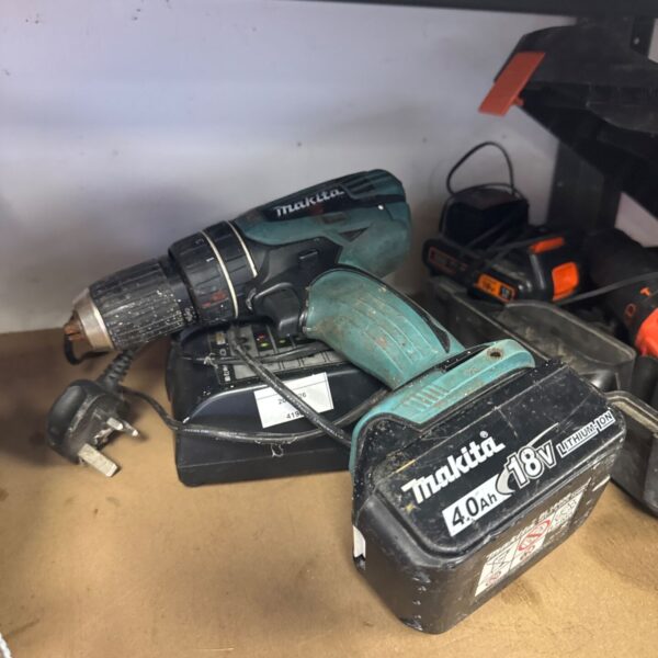 Makita 18V cordless drill with charger, untested condition.