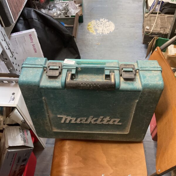 Vintage Makita drill set in a green carrying case.