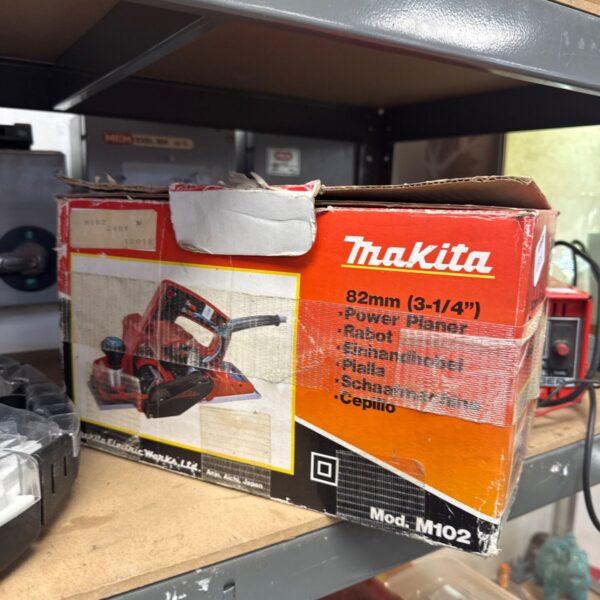 Vintage Makita M102 electric planer, a classic woodworking tool.
