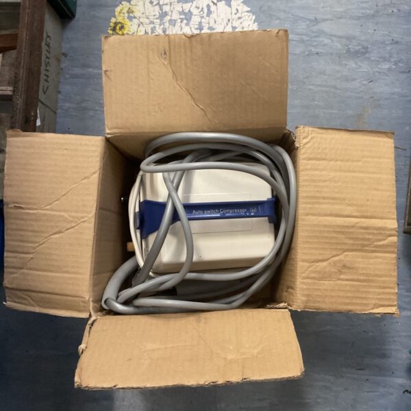 Mangar T Series compressor with hose, used medical lifting equipment.