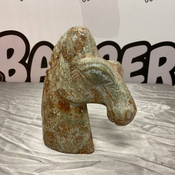 Vintage marble horse bust with green and brown tones.