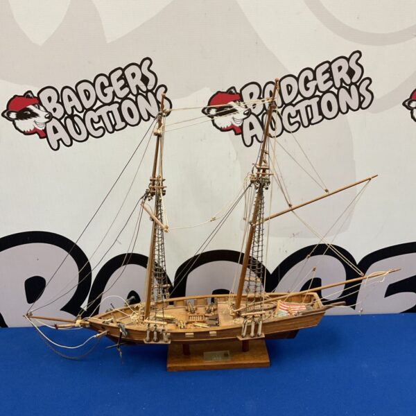 Antique wooden model of the Marco Polo schooner with brass cannons.