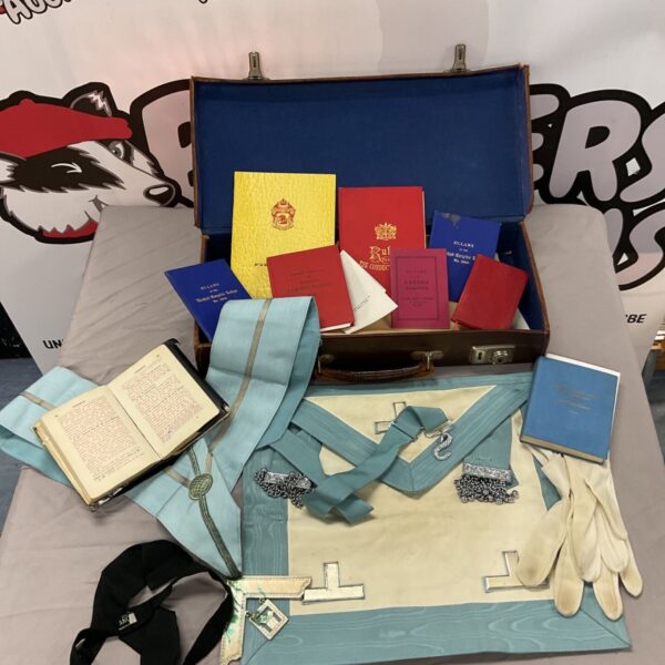 Overview of vintage Masonic collection inside a suitcase.