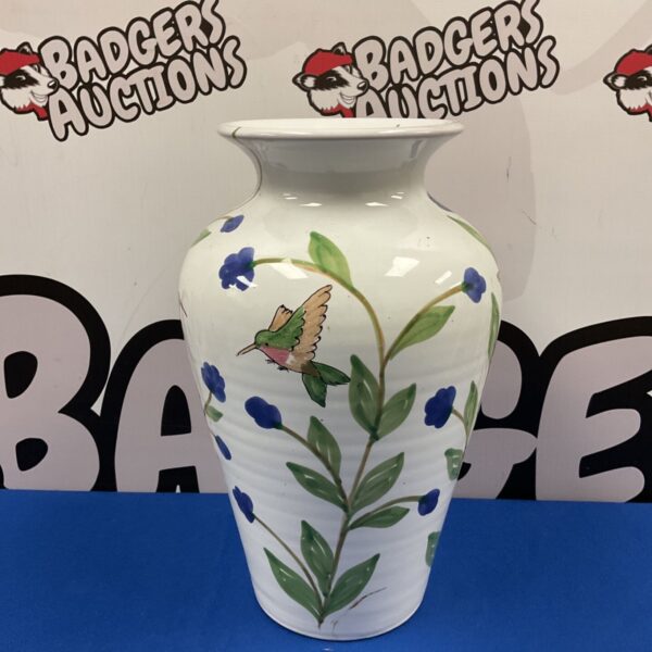 Front view of a hand-painted hummingbird vase by Maya.