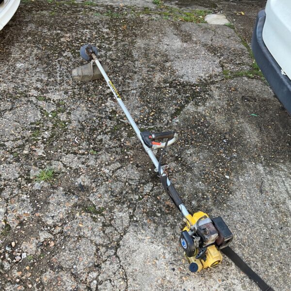 McCulloch petrol strimmer showing the engine and handle.