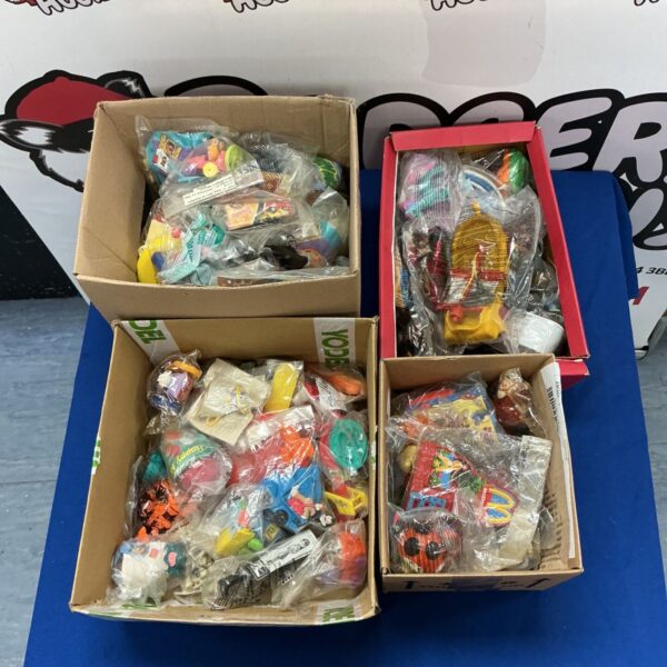 Vintage McDonalds Happy Meal toys in four boxes.