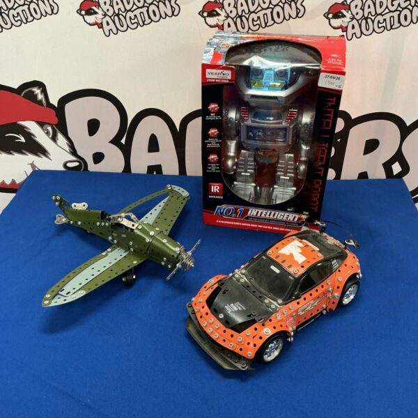 Vintage Meccano robot, RC car, and plane set for collectors.