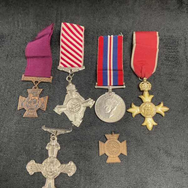 Reproduction and original medal collection including 1939-1945 War medal.