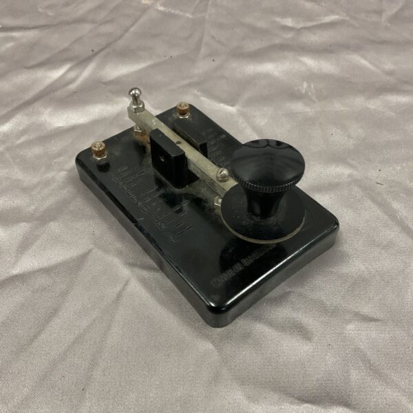 Vintage Merit Morse code key with Bakelite base.