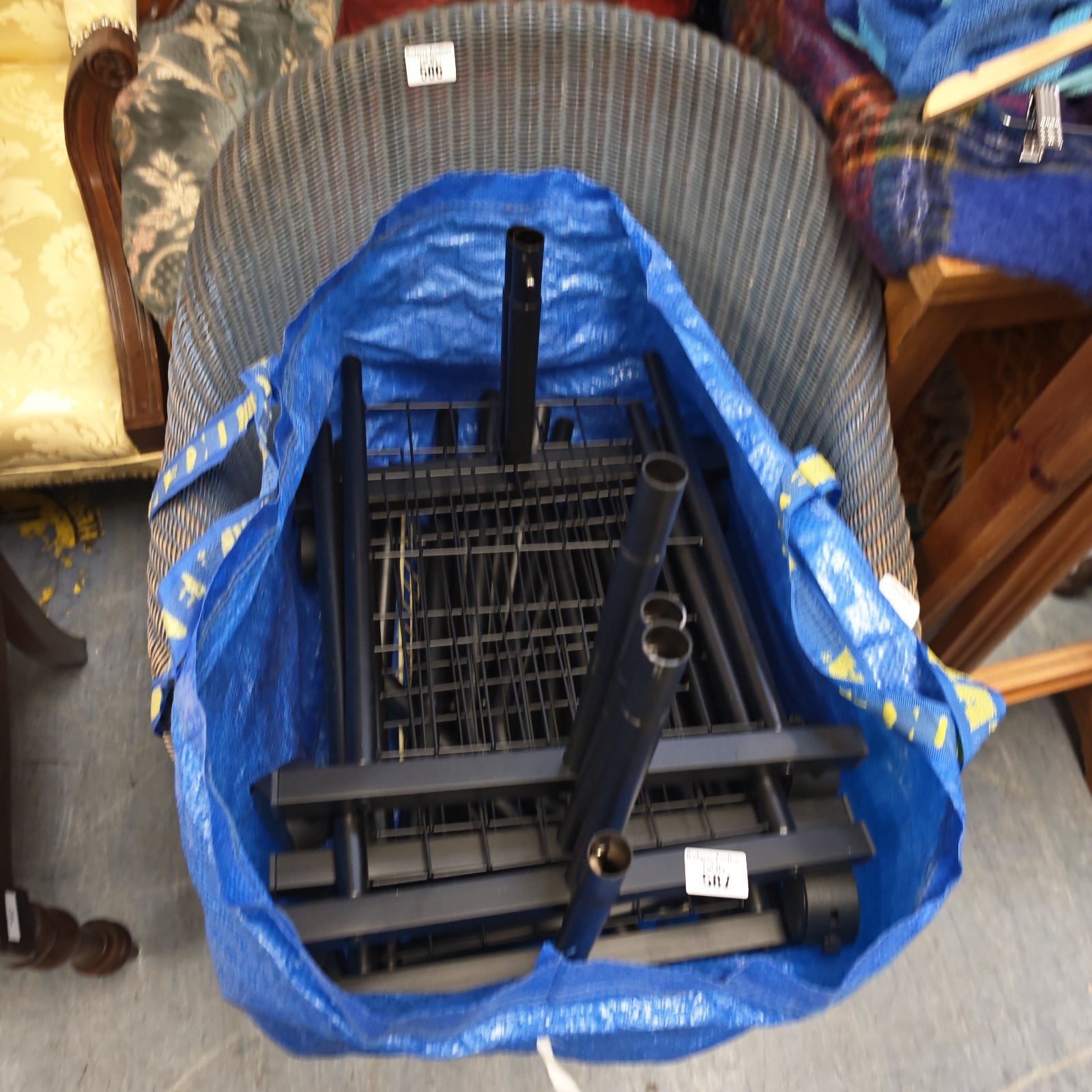 Metal clothing rail covered in blue plastic.