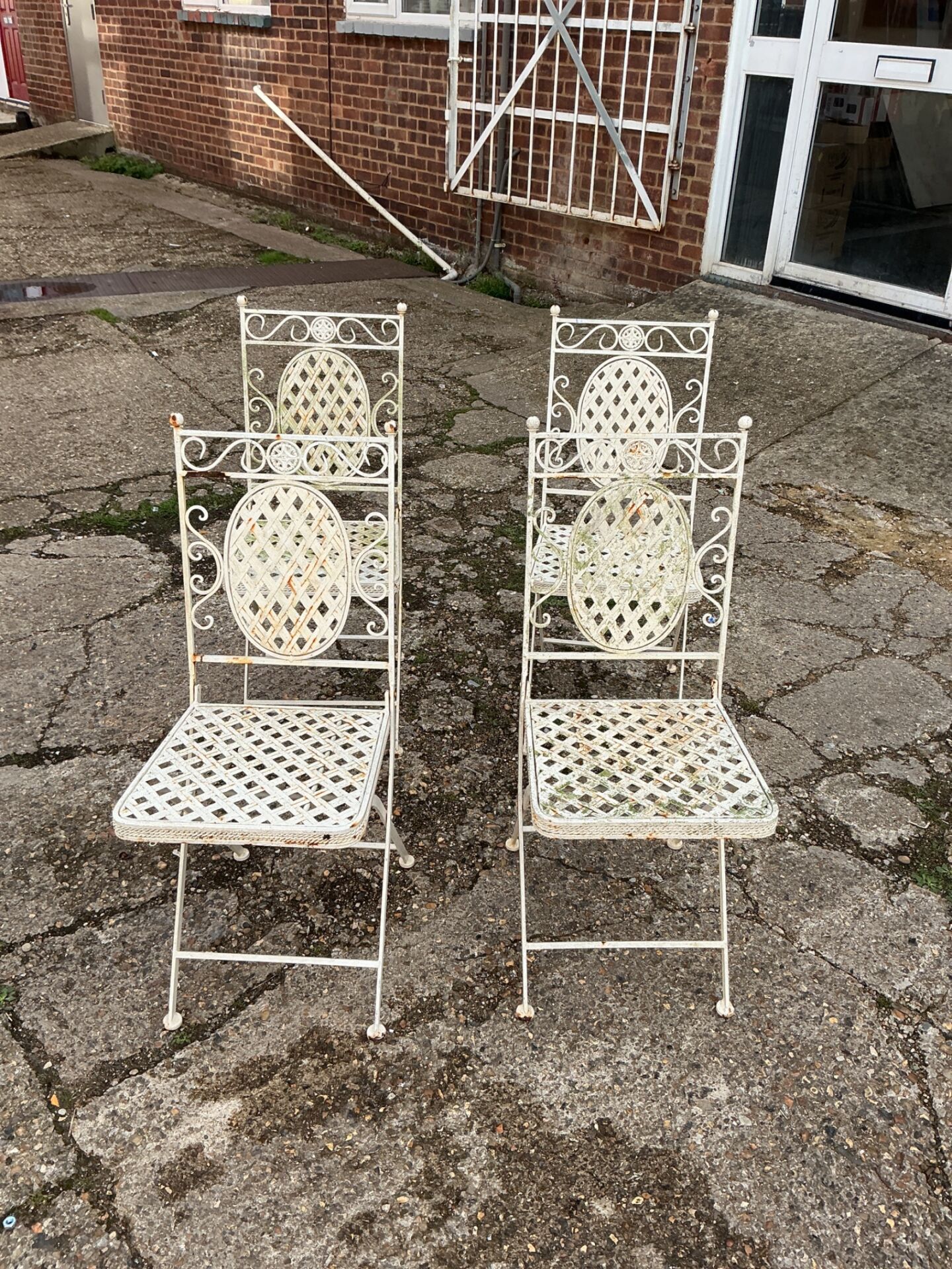 1155 Four metal folding garden chairs