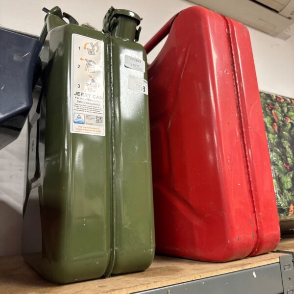 Olive green metal jerry can, vintage fuel container.