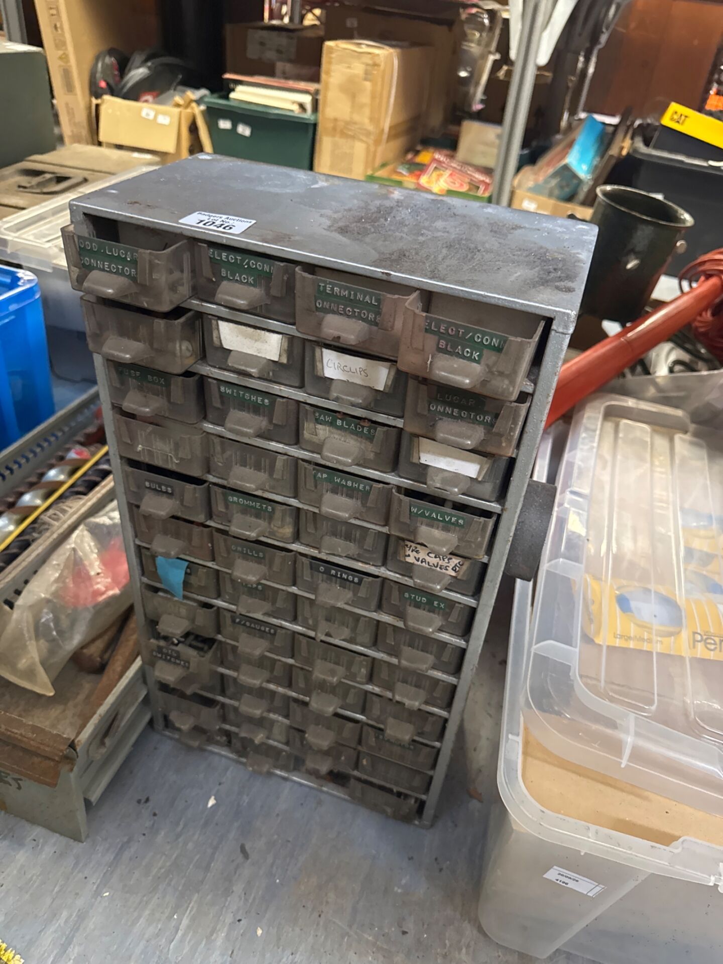 1046 Metal organiser cabinet with contents