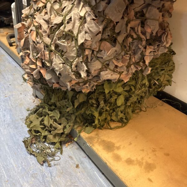 Two sets of used military camo netting in woodland pattern.