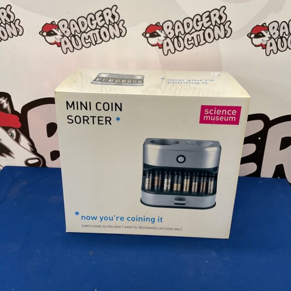 Vintage mini coin sorter for sorting loose change.