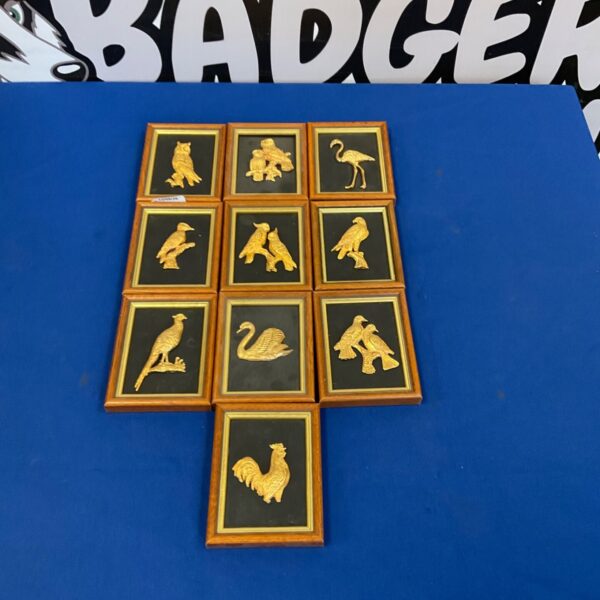 Group of ten miniature framed gold guild bird plaques.