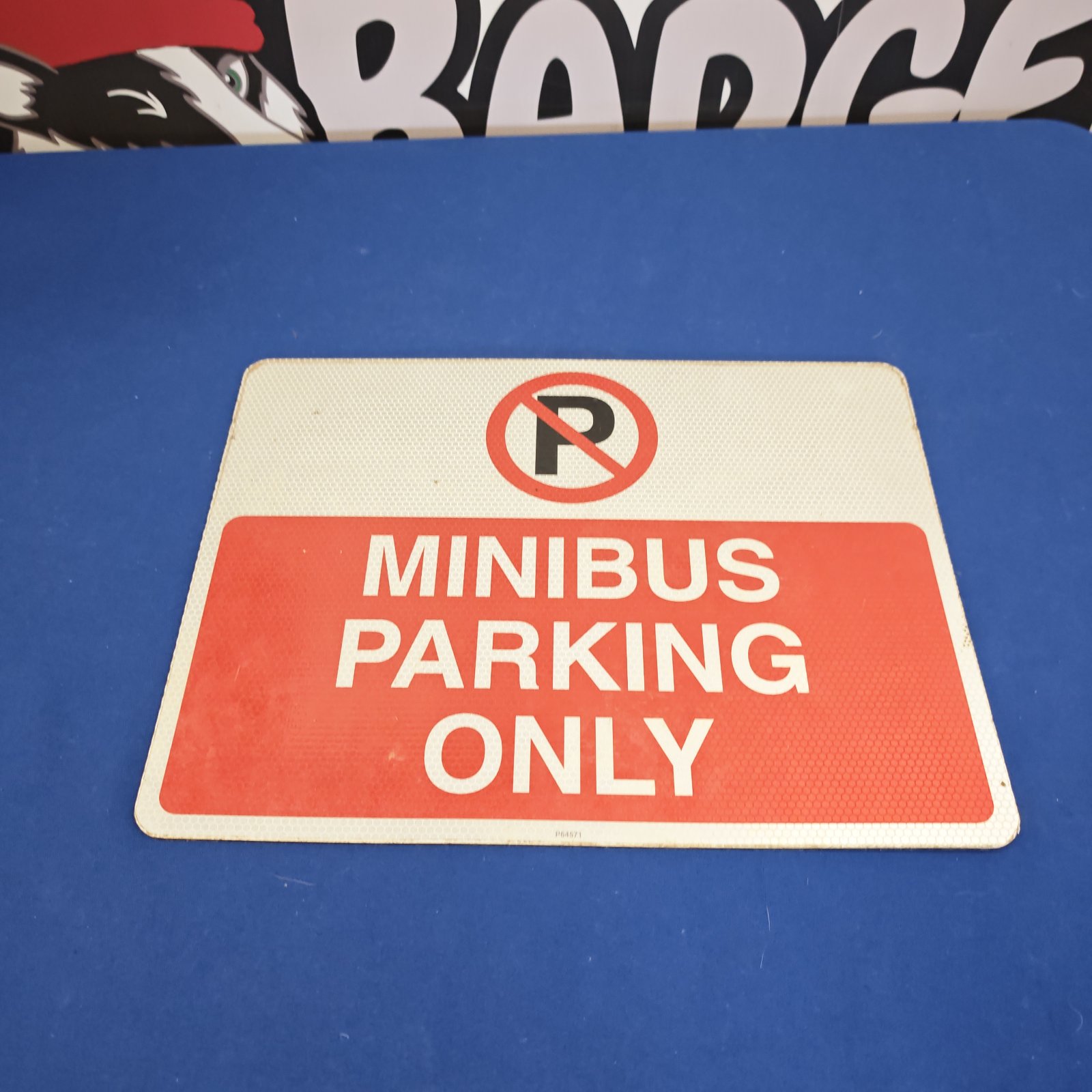 Vintage metal minibus parking restriction sign.