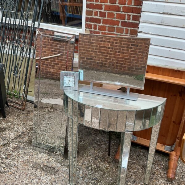 Mirrored side table with clock, vintage home decor.