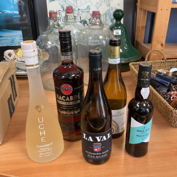 Mixed alcohol lot featuring Bacardi dark rum and coconut rum bottles.