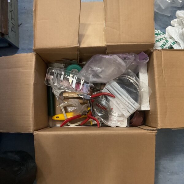 Mixed appliance lot with pliers and rolls of wire visible.