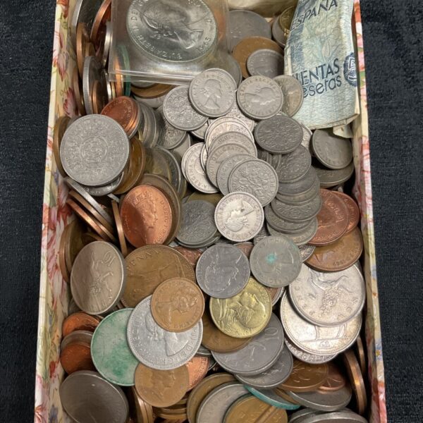 Mixed coin lot with various world currencies and vintage coins.