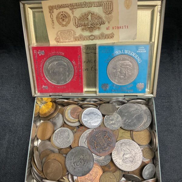 Vintage tin filled with a mixed lot of old coins.