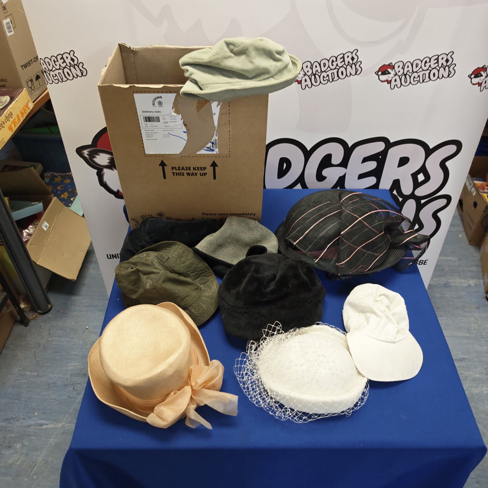 Mixed lot of hats including beanies and occasional headwear.